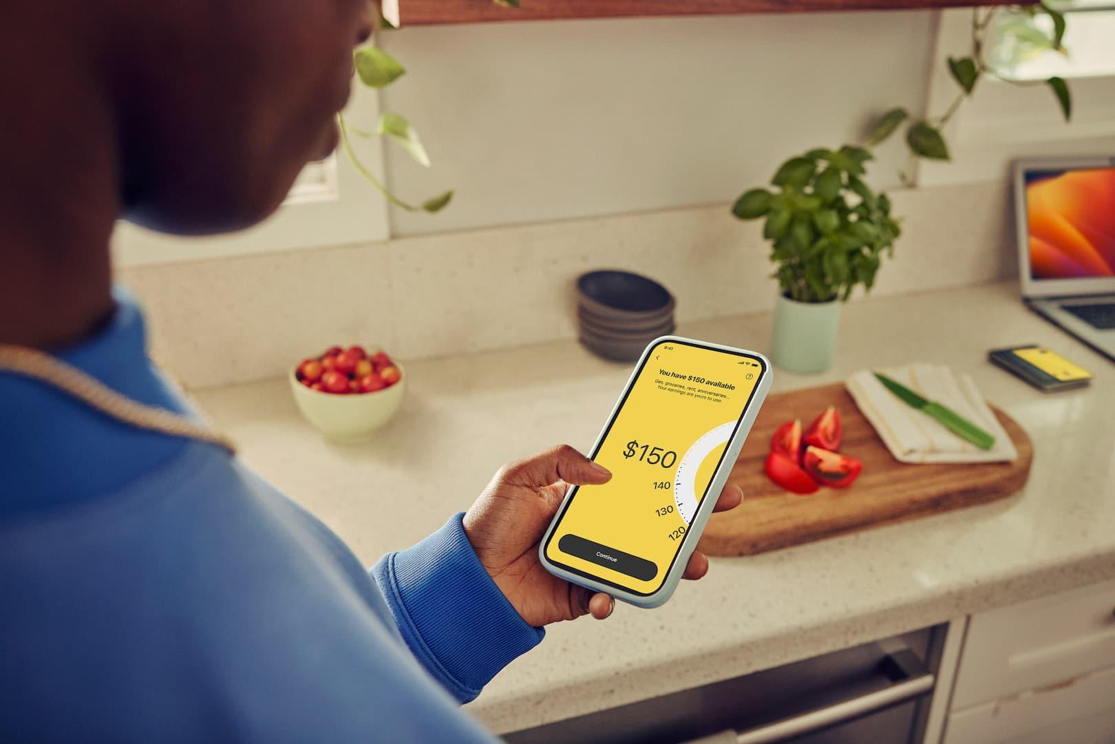 Woman cashing out on mobile app